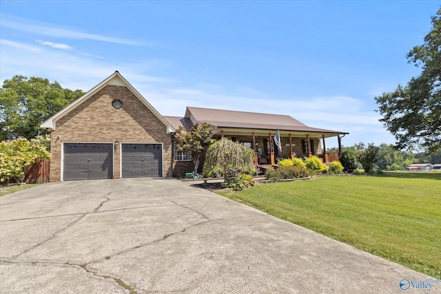 view of front facade featuring driveway, a garage, a front lawn, and brick siding