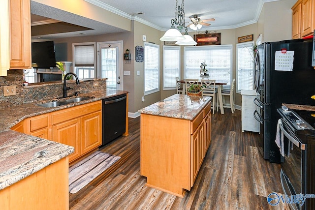 kitchen with pendant lighting, stainless steel electric range, sink, black dishwasher, and a kitchen island