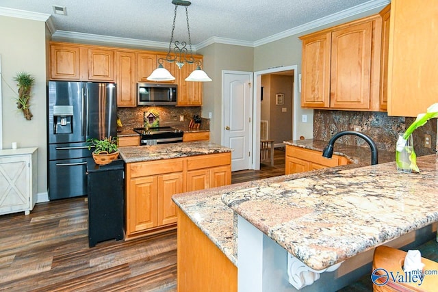 kitchen with decorative backsplash, decorative light fixtures, a center island, and stainless steel appliances