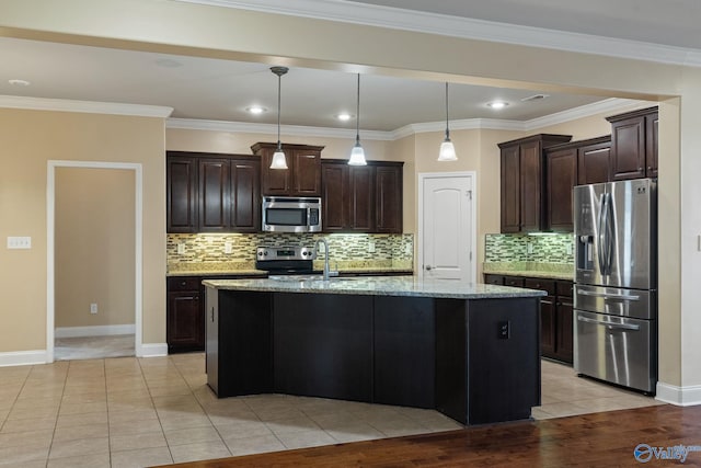 kitchen featuring sink, light stone counters, appliances with stainless steel finishes, a kitchen island with sink, and light hardwood / wood-style flooring