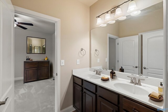 bathroom featuring vanity, a tub, and tile patterned flooring