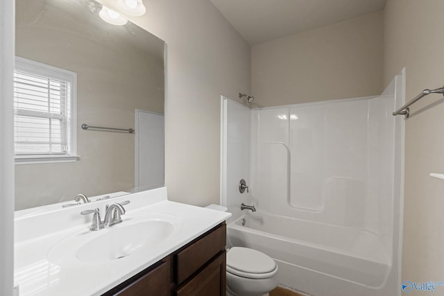 full bathroom with washtub / shower combination, toilet, and vanity