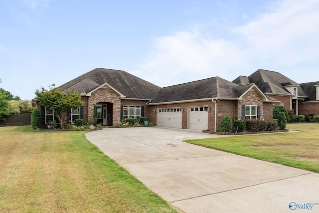 view of front of house featuring a garage and a front lawn