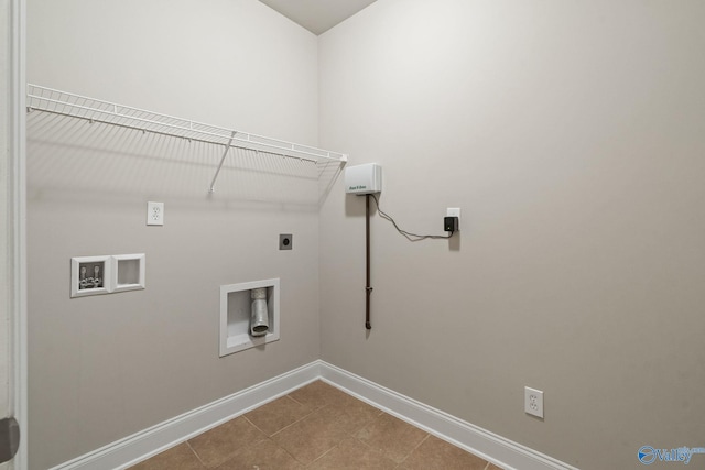 laundry room with hookup for a washing machine, electric dryer hookup, and tile patterned floors