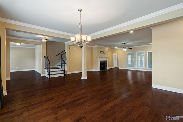 unfurnished living room with dark wood-type flooring, ceiling fan with notable chandelier, and crown molding