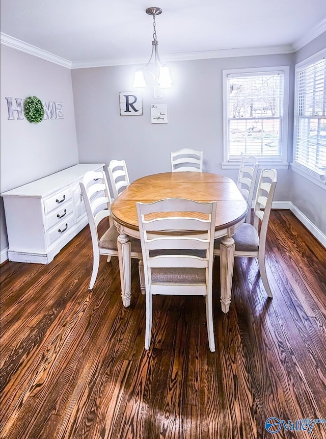 dining room featuring ornamental molding and dark hardwood / wood-style flooring