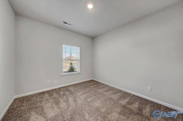 unfurnished room with carpet flooring