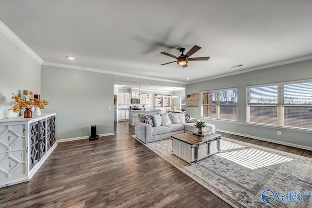 living room with ceiling fan, dark hardwood / wood-style flooring, and crown molding