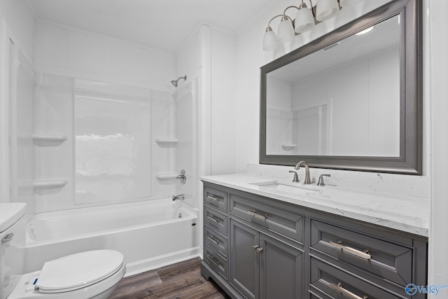 full bathroom with vanity, shower / washtub combination, hardwood / wood-style flooring, and toilet