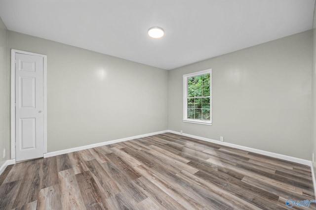 spare room featuring hardwood / wood-style flooring