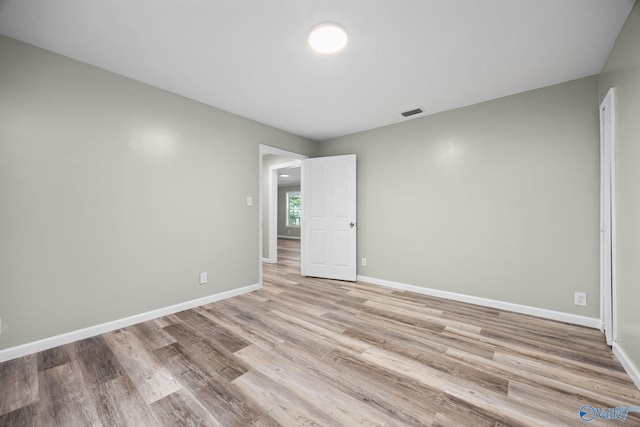 spare room featuring hardwood / wood-style floors