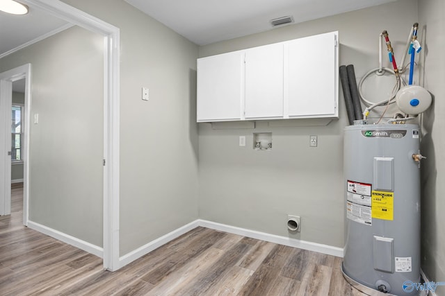 washroom with water heater, light hardwood / wood-style floors, cabinets, washer hookup, and electric dryer hookup