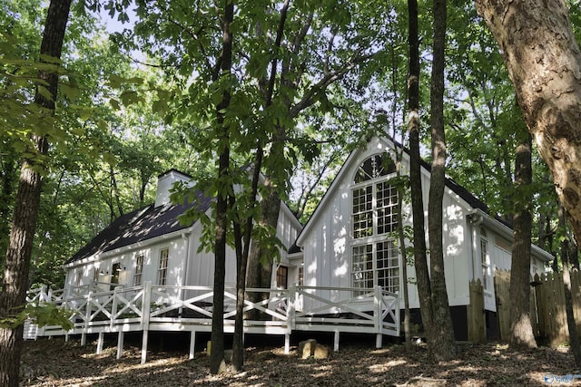 back of property featuring a deck