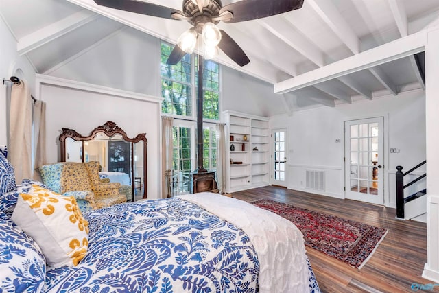 bedroom with hardwood / wood-style flooring, vaulted ceiling with beams, multiple windows, and ceiling fan