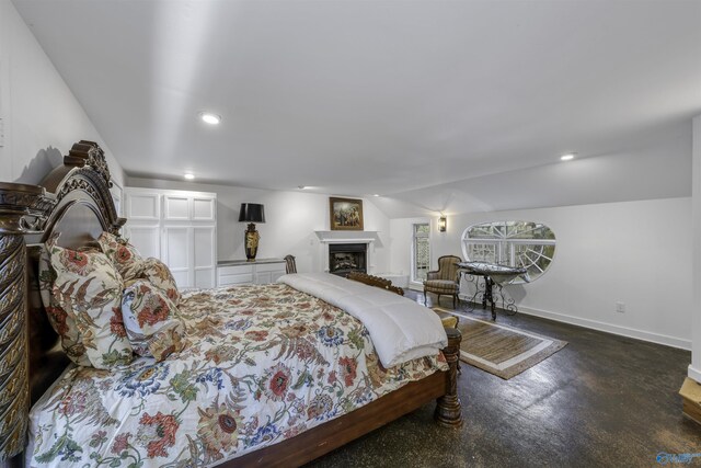 bedroom featuring concrete flooring