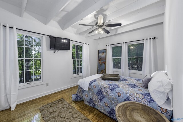 bedroom with beamed ceiling, light hardwood / wood-style floors, and ceiling fan