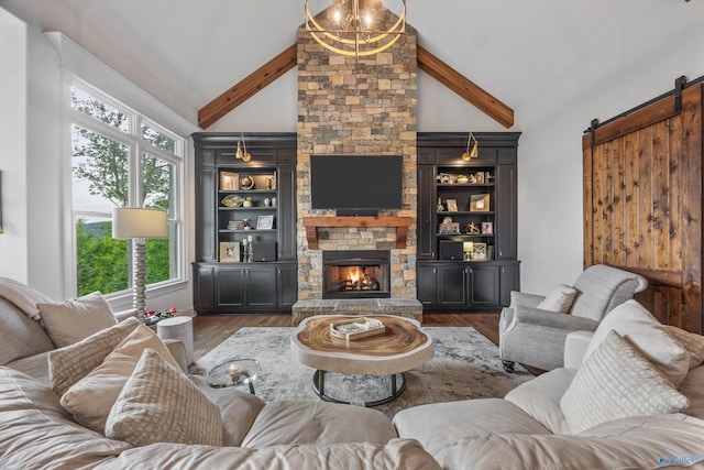 27 Watson Grande Way, Owens Cross Roads, AL 35763 - living area featuring a barn door, a fireplace, high vaulted ceiling, wood finished floors, and beamed ceiling