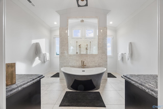 27 Watson Grande Way, Owens Cross Roads, AL 35763 - full bath featuring vaulted ceiling, baseboards, a soaking tub, tile patterned flooring, and walk in shower