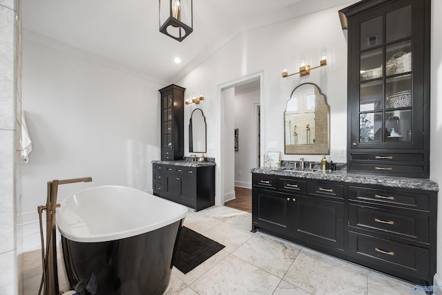 27 Watson Grande Way, Owens Cross Roads, AL 35763 - bathroom featuring two vanities, a freestanding tub, and a shower