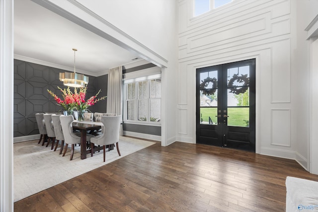 27 Watson Grande Way, Owens Cross Roads, AL 35763 - foyer featuring a chandelier, hardwood / wood-style floors, plenty of natural light, and a decorative wall