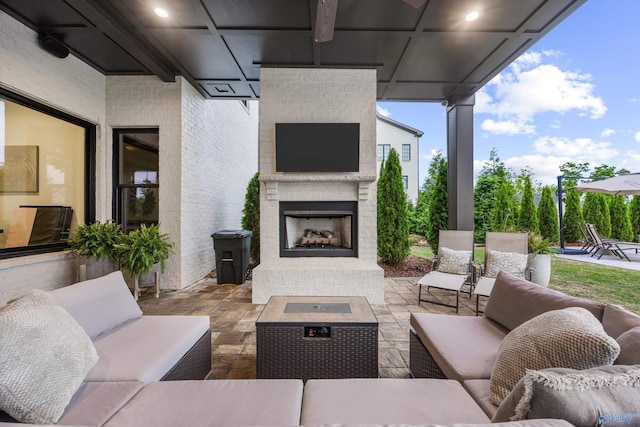 27 Watson Grande Way, Owens Cross Roads, AL 35763 - view of patio / terrace with an outdoor living space with a fireplace