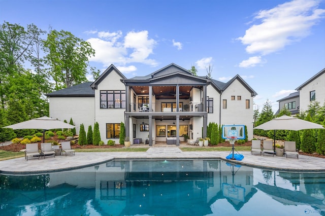 27 Watson Grande Way, Owens Cross Roads, AL 35763 - back of property with a balcony, ceiling fan, a patio area, an outdoor hangout area, and an outdoor pool