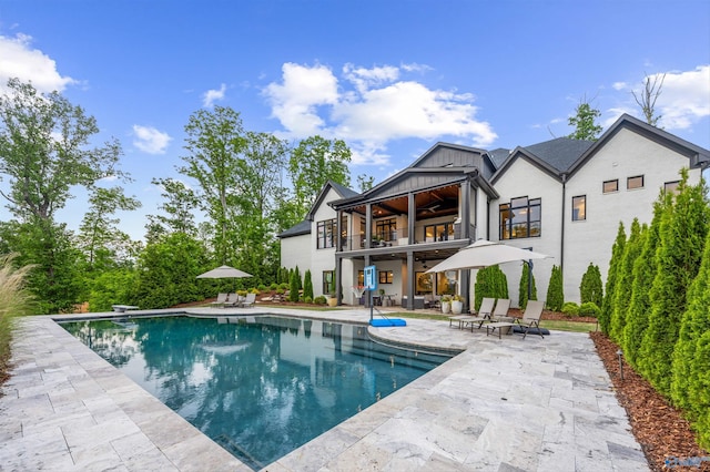 27 Watson Grande Way, Owens Cross Roads, AL 35763 - rear view of house with a ceiling fan, a balcony, a patio area, and an outdoor pool