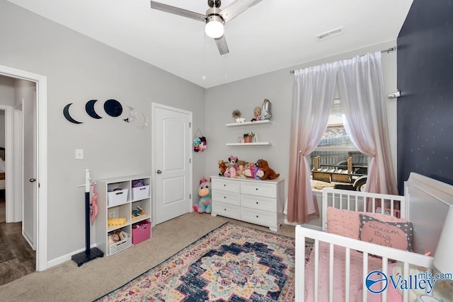 bedroom featuring ceiling fan and carpet