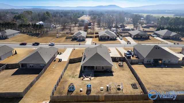 birds eye view of property featuring a mountain view