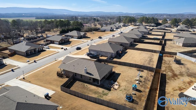 birds eye view of property with a mountain view