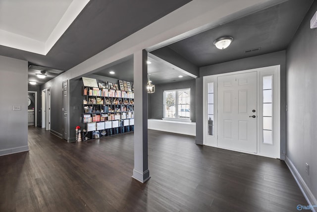 foyer with dark hardwood / wood-style floors