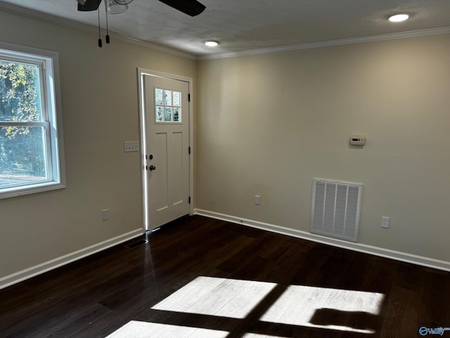 entryway with ceiling fan, dark hardwood / wood-style flooring, and ornamental molding