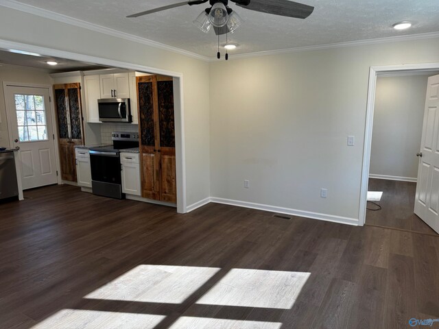 kitchen with decorative backsplash, ornamental molding, appliances with stainless steel finishes, dark hardwood / wood-style flooring, and white cabinetry