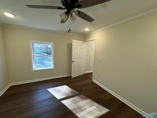 unfurnished room featuring a textured ceiling, ceiling fan, ornamental molding, and dark wood-type flooring