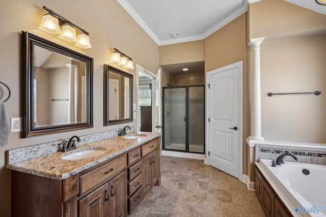 full bathroom with ornamental molding, a stall shower, a sink, and ornate columns