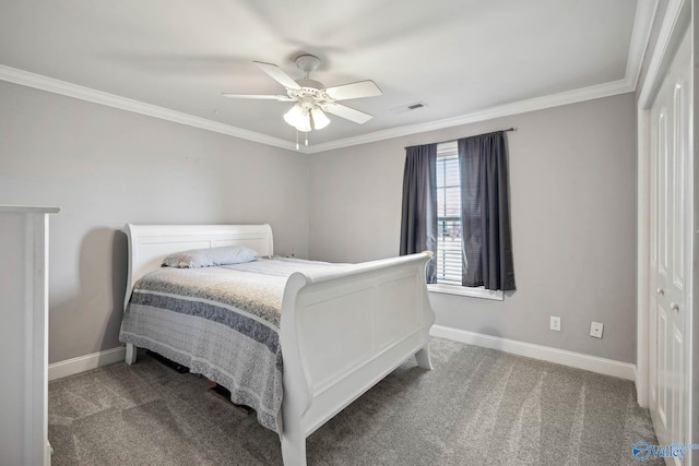 carpeted bedroom featuring a ceiling fan, visible vents, crown molding, and baseboards