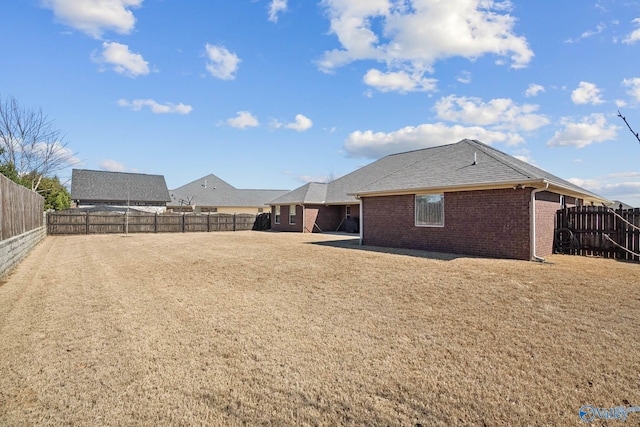 exterior space with a fenced backyard