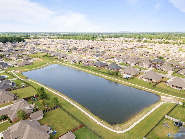 birds eye view of property featuring a water view and a residential view