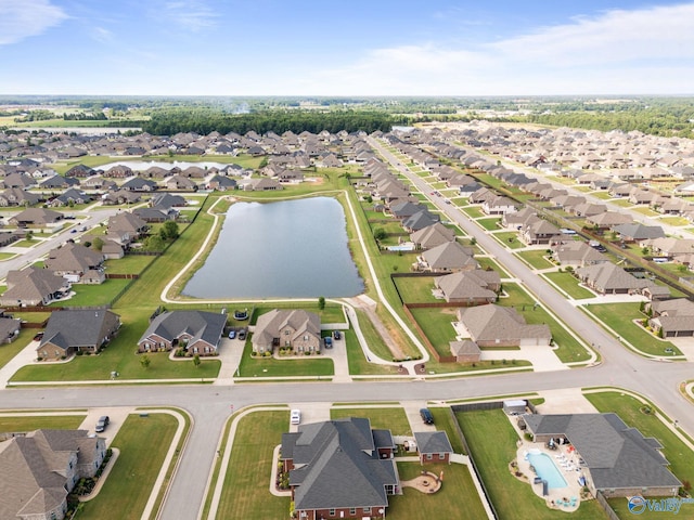 birds eye view of property featuring a water view and a residential view