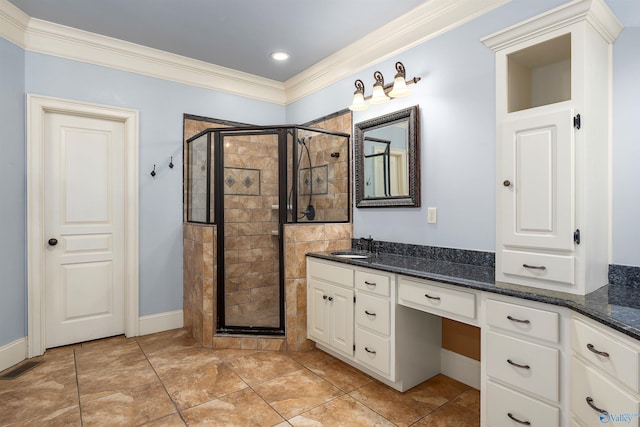 bathroom featuring vanity, ornamental molding, and walk in shower