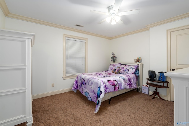 carpeted bedroom with ceiling fan and ornamental molding