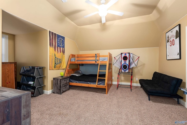 bedroom with ceiling fan, carpet floors, and lofted ceiling