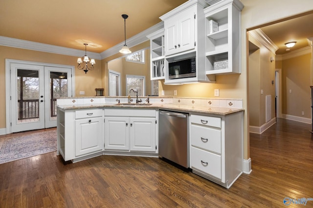 kitchen featuring white cabinets, pendant lighting, sink, and appliances with stainless steel finishes