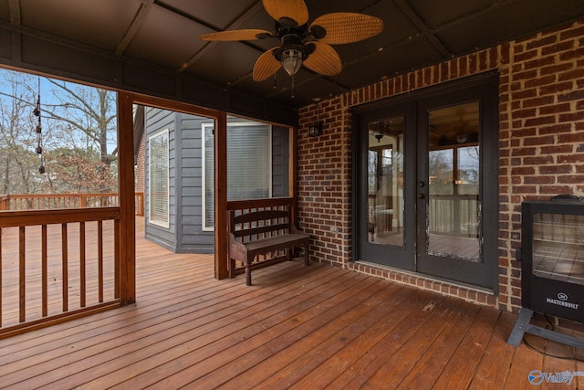 wooden terrace featuring ceiling fan and french doors