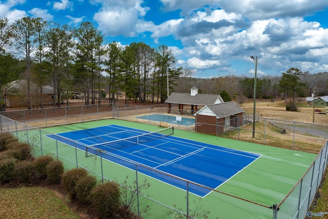 view of tennis court with basketball court