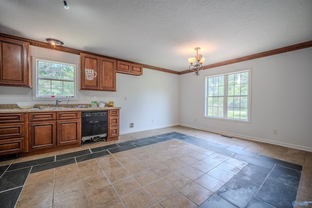 kitchen featuring tile patterned flooring, sink, and plenty of natural light