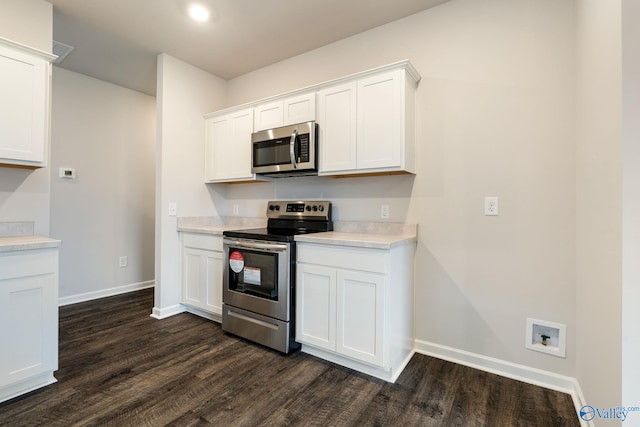 4016 Sherri St SW, Decatur, AL 35603 - kitchen featuring stainless steel appliances, dark hardwood / wood-style floors, and white cabinets
