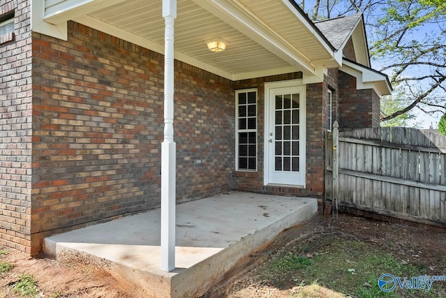 view of patio / terrace featuring fence