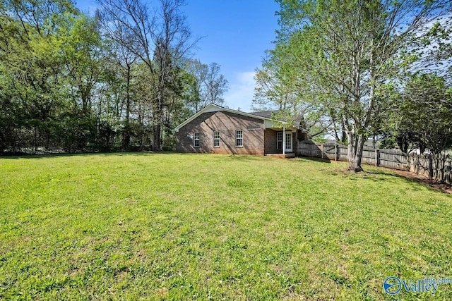 view of yard with a fenced backyard