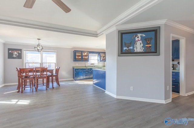 unfurnished dining area featuring dark wood-type flooring and crown molding